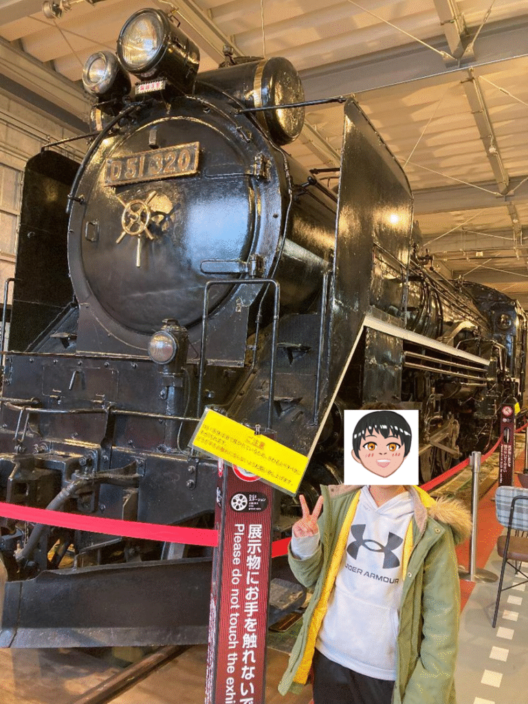 D51前で写真を撮るこどもの様子